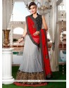 Lustrous Patch Border Work Off White And Red A Line Lehenga Choli