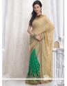 Magnificent Beige And Green Shimmer Georgette Saree
