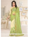 Haute Beige And Green Resham Work Lycra Designer Saree