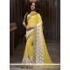 Classy Georgette White And Yellow Patch Border Work Classic Saree