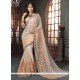 Savory Beige And Peach Georgette Traditional Saree
