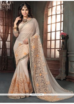 Savory Beige And Peach Georgette Traditional Saree