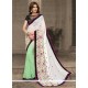 Modish Off White And Sea Green Georgette Traditional Saree