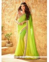 Staggering Green And Yellow Embroidered Work Faux Georgette Shaded Saree