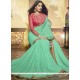 Thrilling Sea Green Patch Border Work Faux Georgette Saree