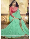 Thrilling Sea Green Patch Border Work Faux Georgette Saree