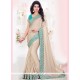 Dazzling Beige And Blue Embroidered Work Faux Georgette Designer Traditional Saree
