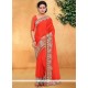 Fashionable Faux Chiffon Orange Patch Border Work Designer Saree