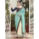 Pretty Cream And Turquoise Patch Border Work Faux Georgette Half N Half Saree