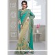 Gripping Net Beige And Sea Green Half N Half Trendy Saree