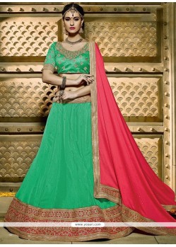 Deserving Net Sea Green Lehenga Choli