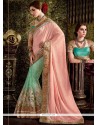 Majestic Pink And Turquoise Zari Work Net Half N Half Saree