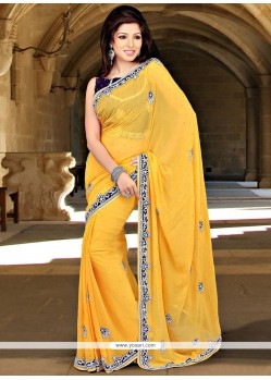 Savory Faux Georgette Yellow Stone Work Classic Saree