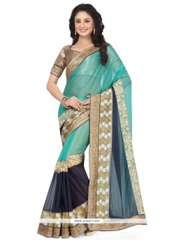 Immaculate Navy Blue And Sea Green Patch Border Work Lycra Saree