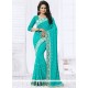 Exotic Embroidered Work Turquoise Faux Georgette Designer Saree