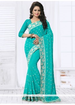 Exotic Embroidered Work Turquoise Faux Georgette Designer Saree