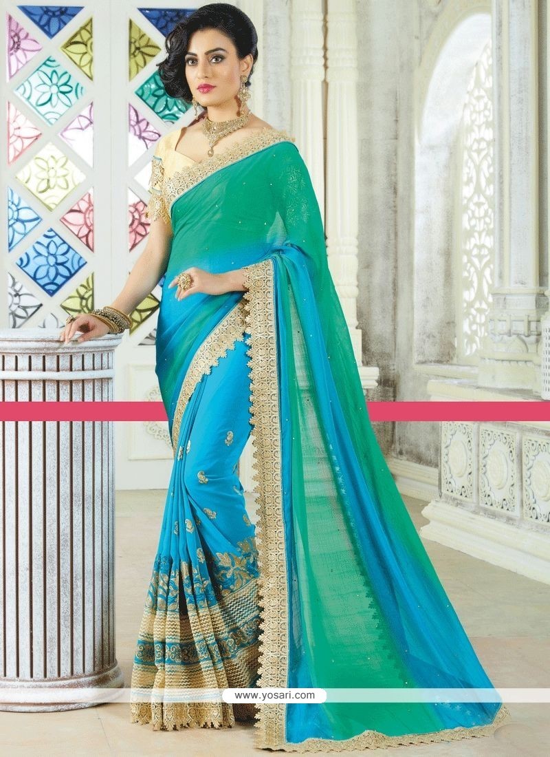 Aspiring Blue And Sea Green Patch Border Work Faux Georgette Shaded Saree
