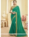 Blooming Faux Georgette Sea Green Patch Border Work Classic Saree