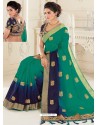 Teal And Navy Blue Raw Silk Woven Designer Party Wear Saree