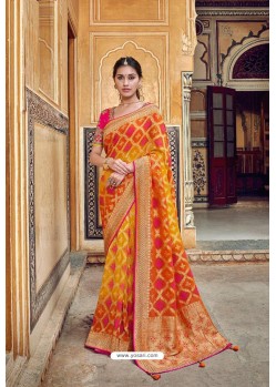 Yellow And Red Banarasi Silk Heavy Embroidered Designer Saree