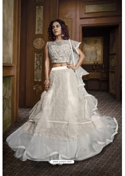 Off White Net Heavy Embroidered Lehenga Choli