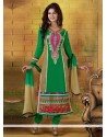 Dignified Green And Cream Embroidery Churidar Suit