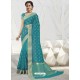 Turquoise Latest Designer Party Wear Raw Silk Sari