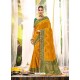 Mustard Heavy Embroidered Designer Wedding Wear Dola Silk Sari