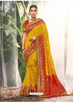 Astonishing Mustard Heavy Embroidered Designer Wedding Wear Dola Silk Sari