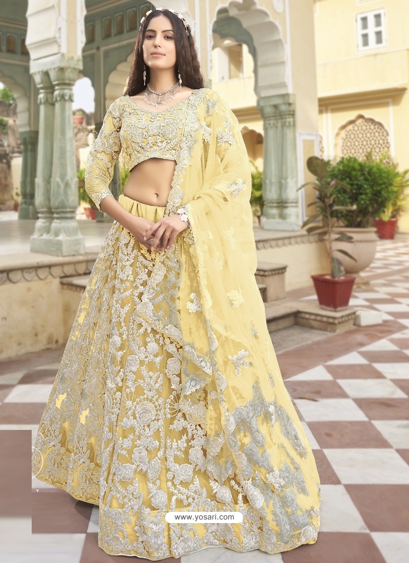 Light Yellow Designer Wedding Wear Heavy Butterfly Net Lehenga Choli
